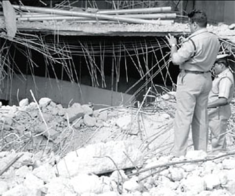 Police at the Prestige building in Whitefield which collapsed recently. The body of a missing labourer was found in the debris/Nagaraja gadekal
