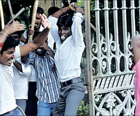 A student of Dr Ambedkar Law College being attacked by his collegemates during a group clash in Chennai on Wedesday.