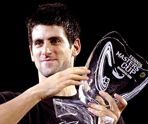 Novak Djokovic of Serbia holds the 2008 Tennis Masters Cup in Shanghai, China. (Photo: AP)