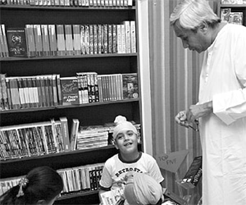 Chief Minister Naveen Patnaik shares a light moment with kids at the children’s corner in Oxford Bookstore in Bhubaneswar.