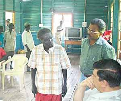 Lt Governor of Andaman and Nicobar Islands Bhopinder Singh (right) discussing the tragedy with the members of the Onge tribe at Dugong Creek on Wednes