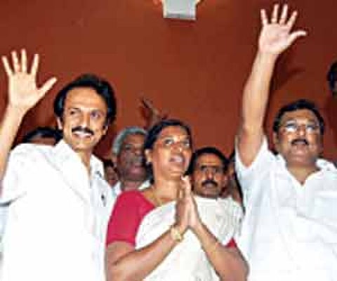 DMK candidate Latha Adhiyaman flanked by MK Stalin and MK Azhagiri.