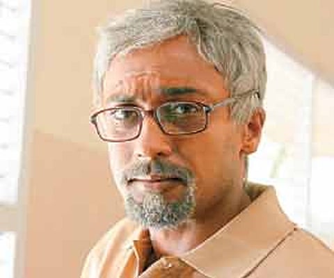 Suriya as the father in the film Vaarnam Aayiram