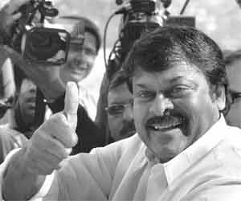 Thumbs up: Praja rajyam party chief chiranjeevi gestures while addressing media outside the election commission office in new delhi on monday.