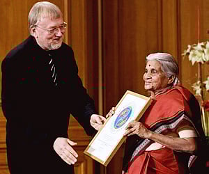 Johan von Uexkull hands over the Right Livelihood Award to Krishnammal Jagannathan in the parliament building in Stockholm, Sweden. (Photo: AP)