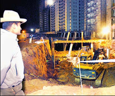 Police inspecting the collapsed parking complex at Prestige Shantiniketan on Monday/Nagaraja Gadekal