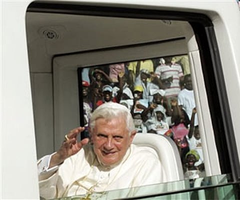 Pope Benedict XVI waves as he arrives to meet with the young people at the Coqueiros stadium in Luanda, Angola. (Photo: AP)