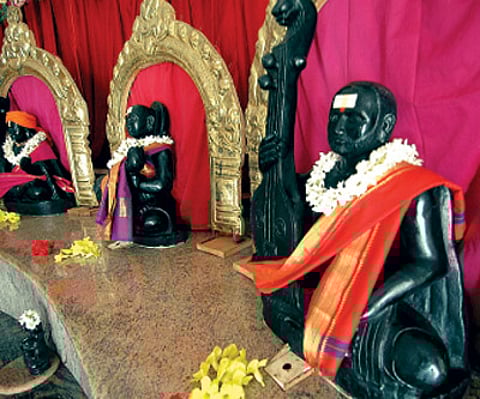 PAGODA OF MELODY: (Clockwise from top right) The Saptaswara Devatha Dhyana Mandira modelled in the shape of the tambura; a statue of instrumentalist H