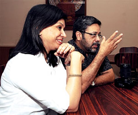 (Above) Orko poses with Ramamurthi and Nelson while his father, Kaushik takes their picture; (Below) Nina and Kaushik share their experiences