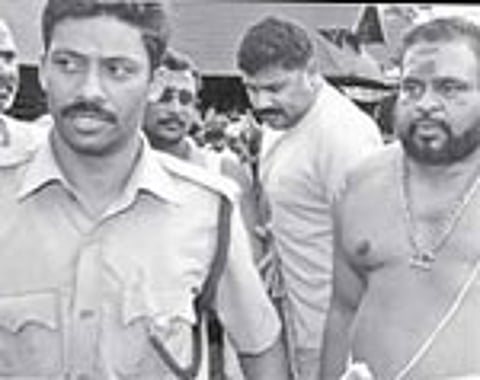 Kandararu Mohanaru and nephew Rahul Easwar on the Sabarimala temple premises after offering prayers on Monday.