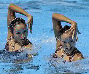 China's Jiang Tingting and Jiang Wenwen perform on their way to win the bronze medal of the duet technical synchronized swimming event. (Photo: AP)