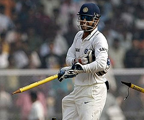 Mahendra Singh Dhoni celebrates after India won the third cricket test match against Sri Lanka. (Photo: AP)