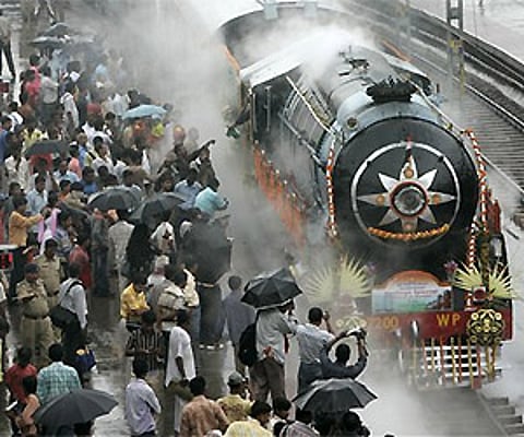 Century-old steam locomotive pulls train