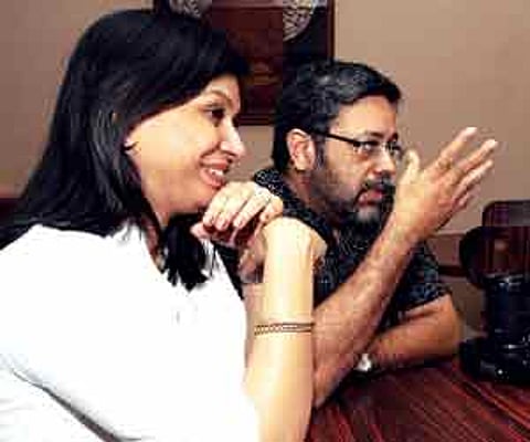 Orko poses with Ramamurthi and Nelson while his father, Kaushik takes their picture; (Below) Nina and Kaushik share their experiences