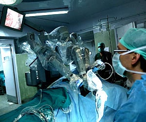 Doctors supervise a robotic surgery at All India Institute for Medical Sciences in New Delhi. (PTI File Photo)