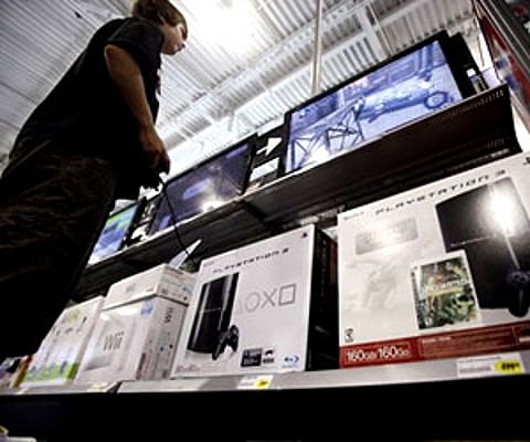A Best Buy customer plays a game on a Sony Playstation 3 in Mountain View, Calif. (AP / File photo)