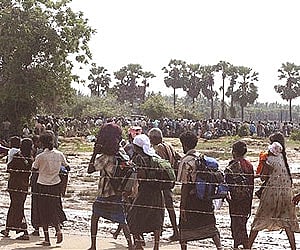 Tamil civilians who escaped from the Tamil Tiger controlled areas are seen arriving in government controlled areas. (Photo: AP)