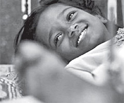 A file picture of Devika Rotawan, who was hit by a bullet during the Mumbai attacks, at a hospital.