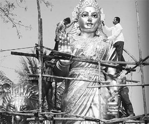 Workers giving final touches to the Bharata Mata statue at Hanuman Junction on Thursday/Pic: Ch Narayana Rao.
