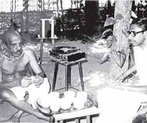 K P Achuthan with Basheer under the mangosteen tree.