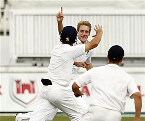 England's bowler Stuart Broad celebrates with teammates after dismissing S Africa's batsman AB de Villiers on the fourth day of the Durban Test. AP