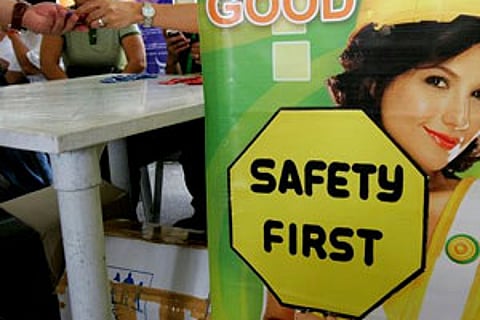 Free condoms are given to visitors at a fair held on the occasion of World Population Day in Manila, Philippines. (AP)