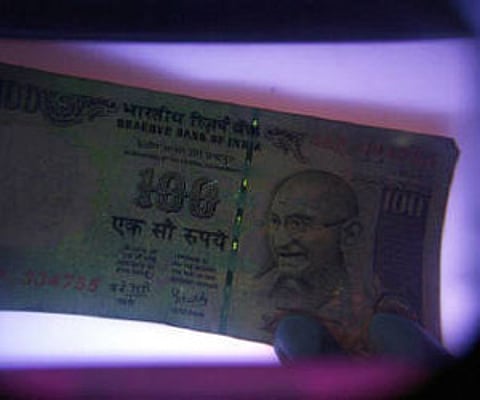 A bundles of U.S. dollar notes. (Photo: AP)