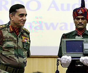 General Deepak Kapoor looks at the Enhanced Tactical Computer during the presentation ceremony of "Shakti Dedication to Indian Army" in New Delhi. PTI