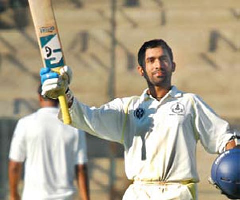 South Zone’s Dinesh Karthik celebrates his century against Central Zone in the Duleep Trophy in Bangalore on Saturday.