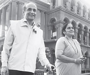 Karavali Ale editor BV Seetharam walks out of the High Court with his wife Rohini after his bail was granted in Bangalore on Tuesday.