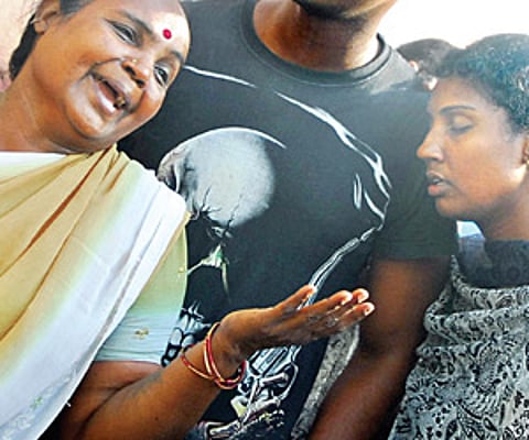 DISTRAUGHT: Shantha, the grieving wife of ‘Welding’ Kumar, with her daughter Divya at the Government General Hospital, in the city on Wednesday.