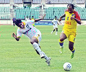 Tamil Nadu football team captain Kulothungan battles for the ball with Goa’s Covan Lawrence.