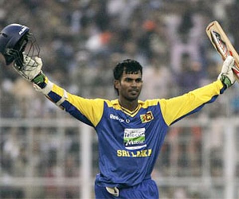 Sri Lanka's Upul Tharanga acknowledges the crowd after scoring a century against India during their fourth ODI in Kolkata. (Photo: AP)