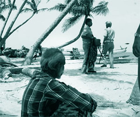 As a tentative peace descends on the coastal areas of Beemapally, a man sits alone on the sands as if he has nothing much to look forward to/Rajeev.
