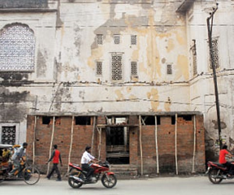A public toilet being constructed along the wall of the Goshamahal Baradari building in Hyderabad.