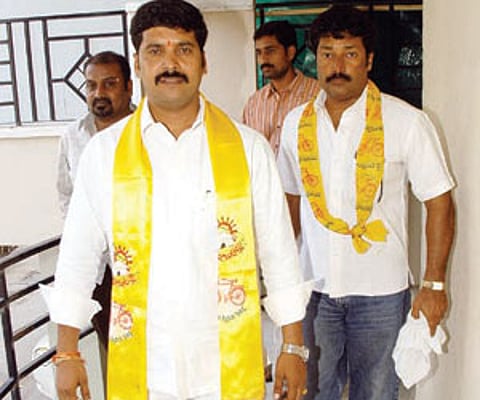 A Krishna Reddy walks out for a day of campaigning in Barkatpura division, on Monday.