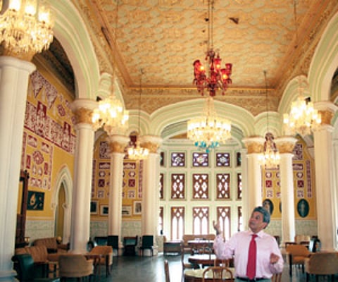Micheal Ludgrove inside one of the halls of the Bangalore Palace, (right) an exhibit in the refurbished setting