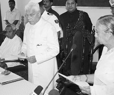 BJD MLA Sugnana Kumari Deo being administered oath as pro tem Speaker of the newly elected Assembly by Governor MC Bhandare at Raj Bhavan.