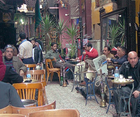 Clockwise from left: Sheeshas on sale in Cairo; woman making bread; the El Fishawy’s, the oldest café inside the Khan al Khalili bazaar; the Mosque o