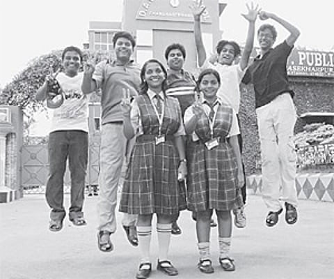 Ananya Das (front right) flashes victory sign as students of DAV Public School CS Pur celebrate their success in the CBSE-X examination in Bhubaneswar