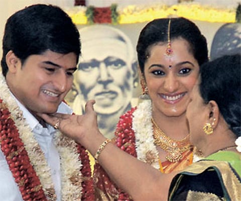 Veteran actor Manorama greets groom Premanand and bride Poonkuzhali, granddaughter of Chief Minister M Karunanidhi.