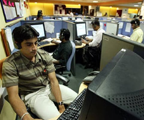 Employees at a call centre provide service support to international customers in Bangalore in this March 2004 (File photo/Reuters)