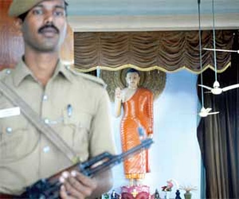 A securityman guarding the Maha Bodhi Society Temple in Egmore.
