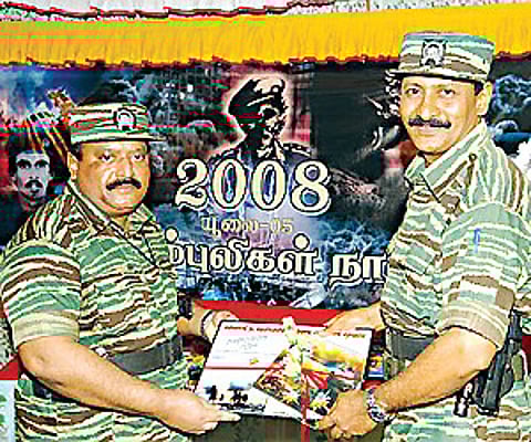 LTTE chief Prabhakaran (L) seen with Pottu Amman, the intelligence chief .