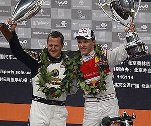 Race of Champions winner Sweden's Mattias Ekstrom, at right raise his trophy with runner up Michael Schumacher . AP Photo