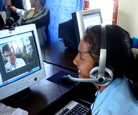 Representative Image: Archana, a ninth grade student, using the web-based video conferencing school to chat with a friend in a government school 250 km away.