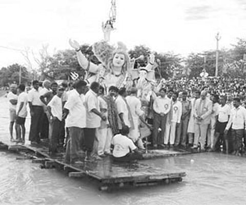 COLOURFUL ADIEU: An idol of Lord Ganesh being immersed at Vinayak Ghat in Kurnool City on Monday