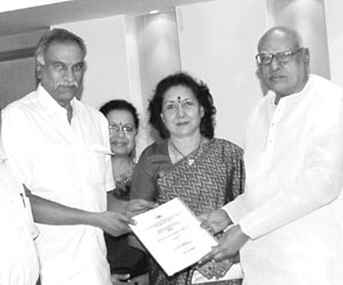 Chairman of Nandi Awards Committee Tammareddy Bharadwaja presenting the committee report to Chief Minister K Rosaiah in Hyderabad on Saturday. Tourism