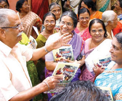 Old students of the Cotton Hill Girls’ Higher Secondary School crowd around Lt Col (Retd) S.T.T. Thampi at Sunday’s reunion.