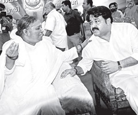 Mohanlal sharing a light moment with Mata Amritanandamayi at the function to celebrate the birthday of the Mata at Amritapuri in Kollam on Saturday.